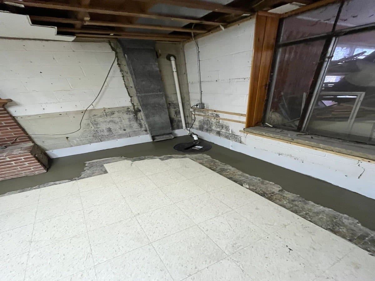 Interior perimeter drain and sump basin installed by SuperDry Basements